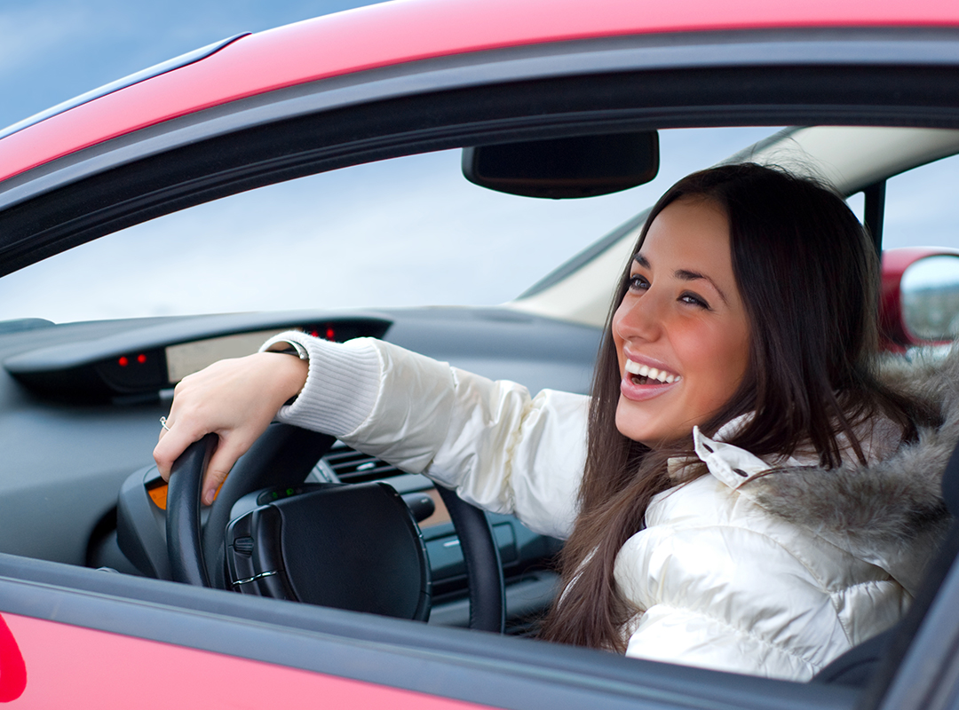 woman driving car in winter